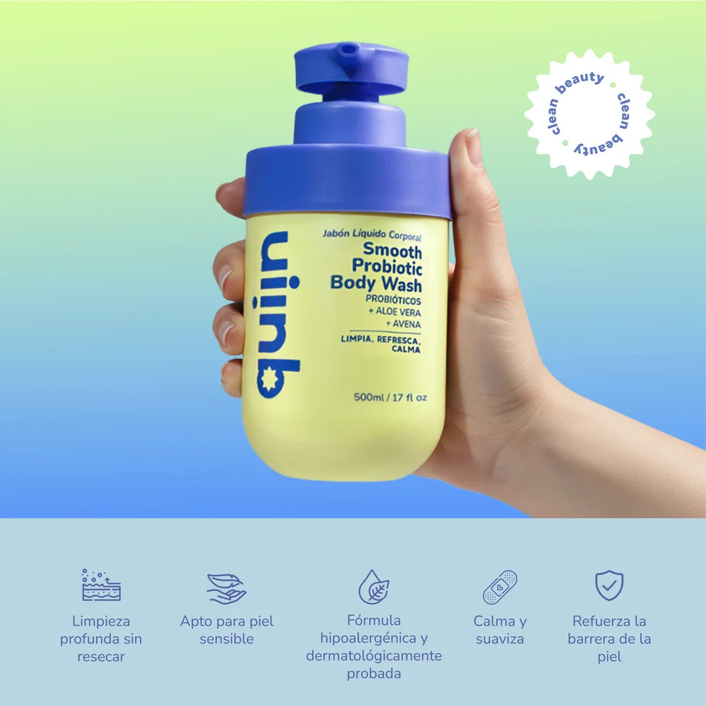 Mano sosteniendo el gel de baño Quiin Smooth Probiotic Body Wash con sus beneficios